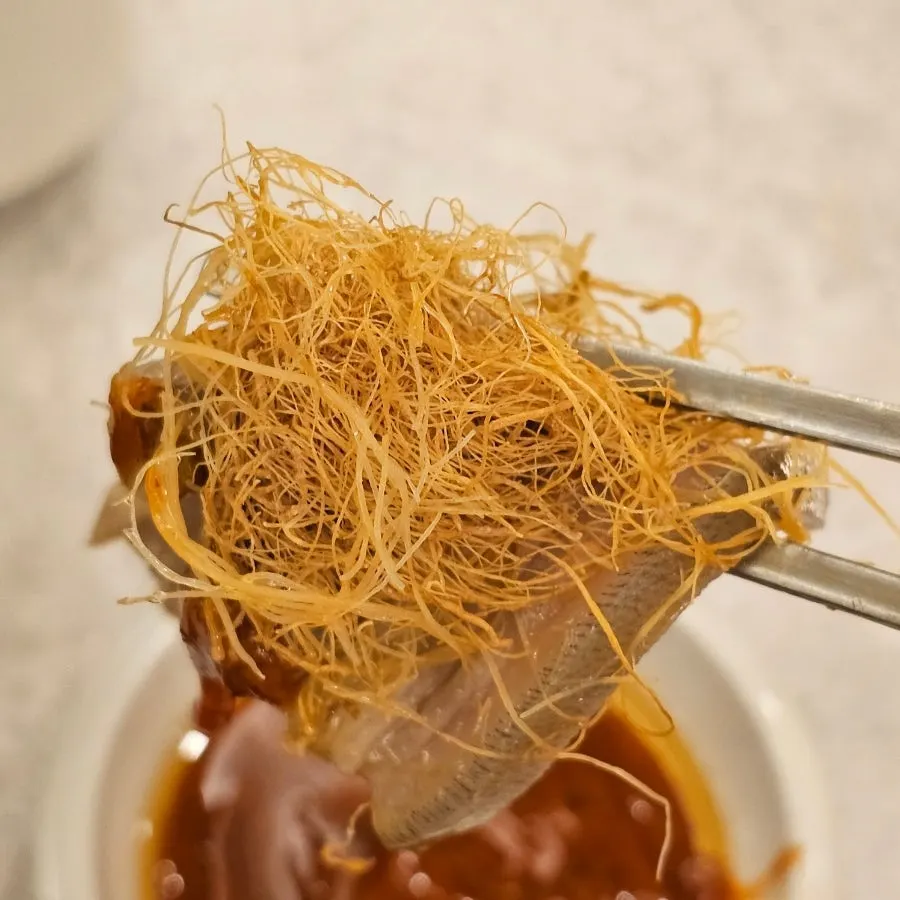 Black goat health-boosting dish topped with wild ginseng root and mushrooms