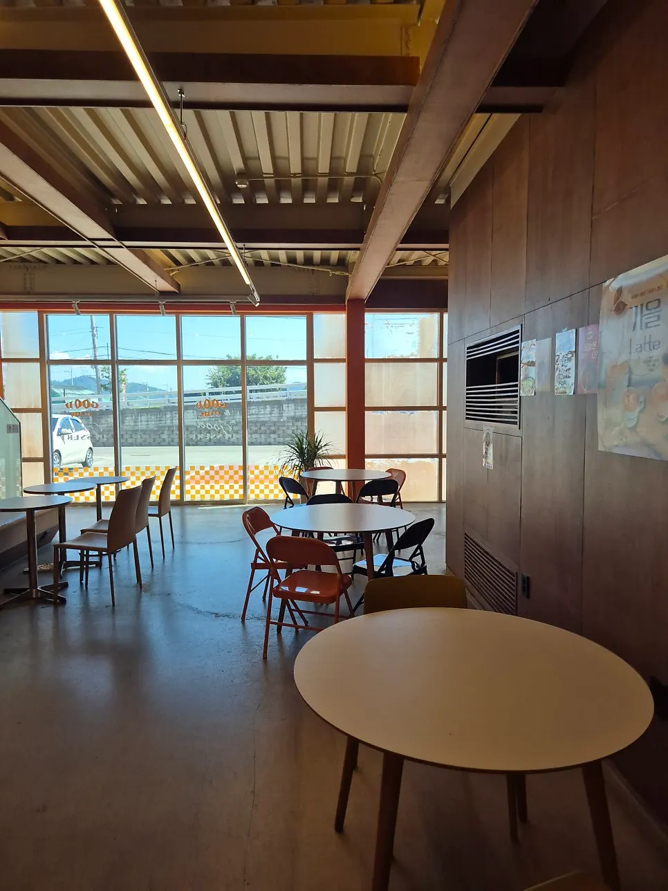 Spacious table seating on the second floor of Otters