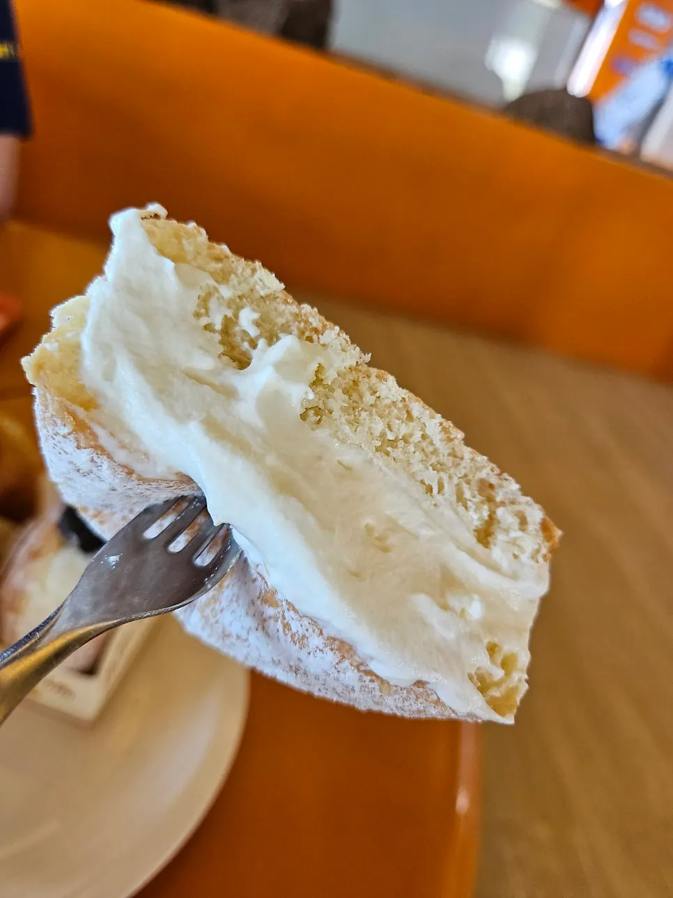 Close-up of a cream-filled Otters doughnut cross-section