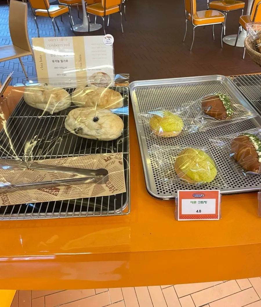 Tray of Otters cream donuts on display