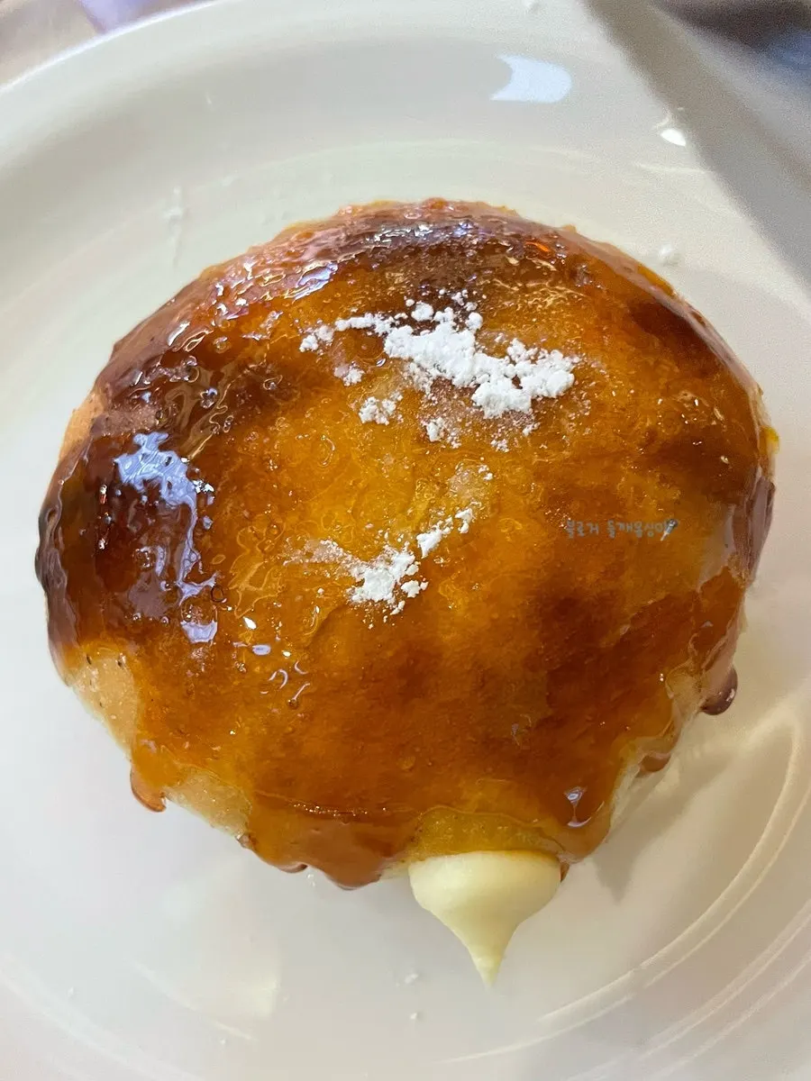 Real milk cream donut cut in half