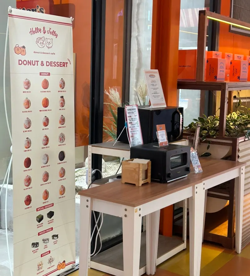 Banner listing doughnut and dessert menu items