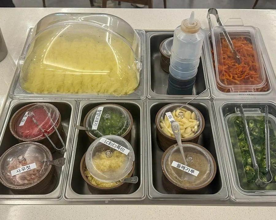 Somyeon noodles and dessert fruit corner at the self-serve bar