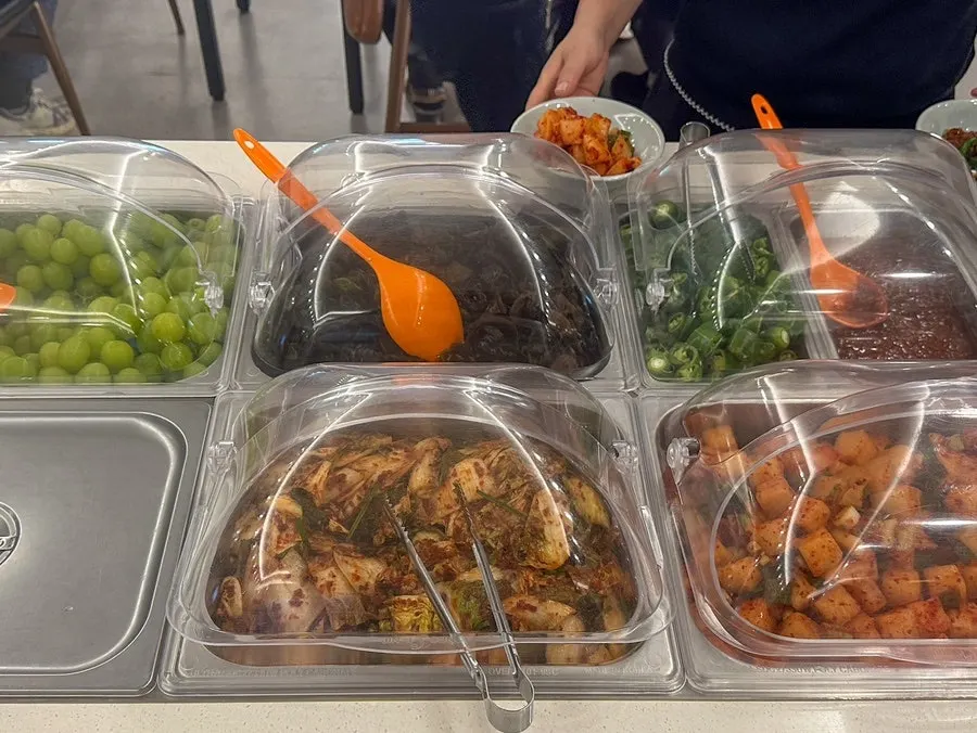 A plate of side dishes gathered from the self-serve bar