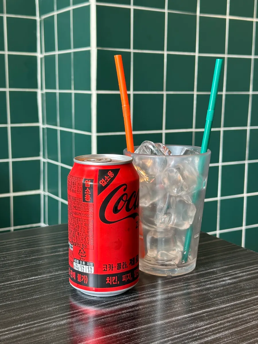 Zero Coke served with an ice cup and straw