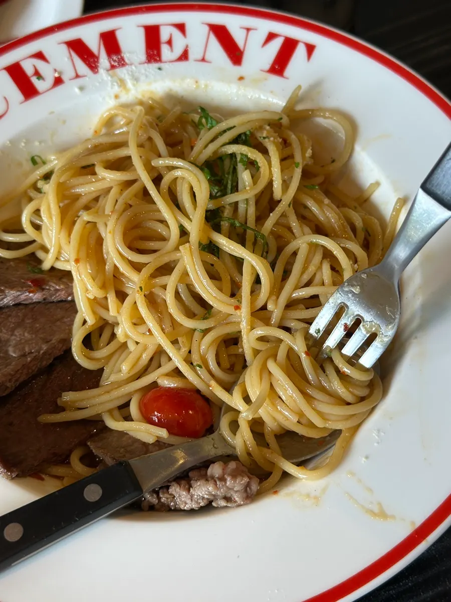 Pasta plate with leftover cherry tomatoes and oil sauce