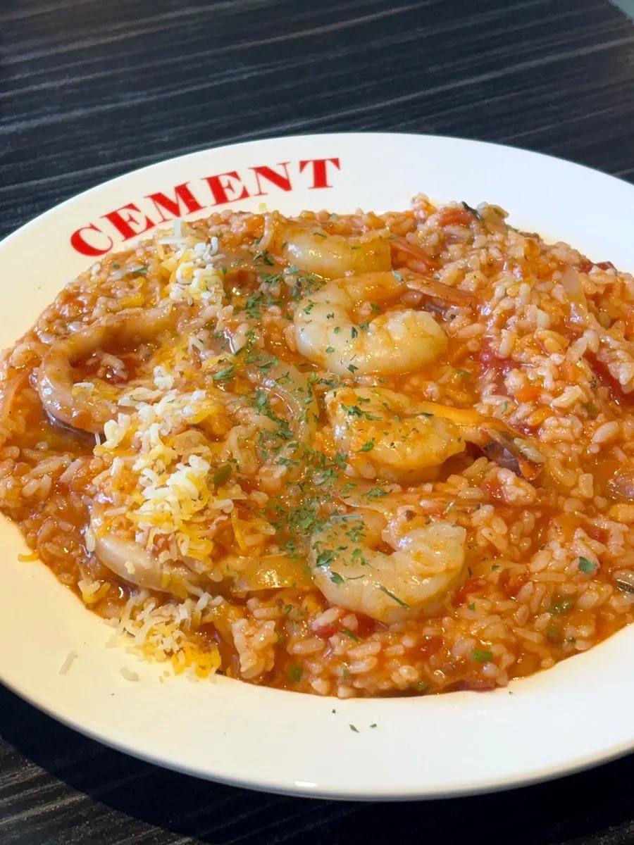 Cream pasta topped with bacon and cheese