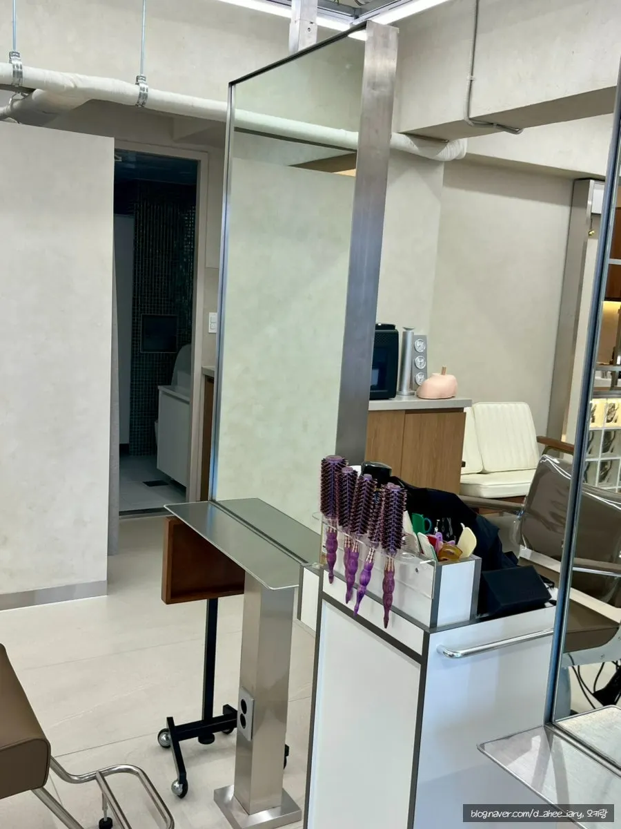 Interior of Wedon Hair Gunja in white and wood tones