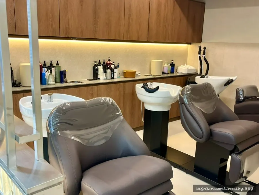 Salon styling area with many mirrors