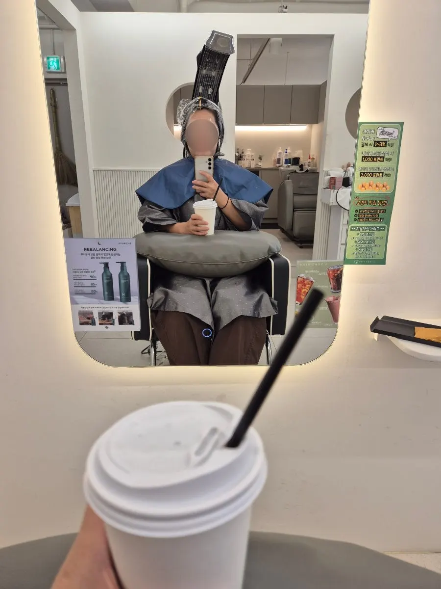 Magic perm solution being applied and heat-processed