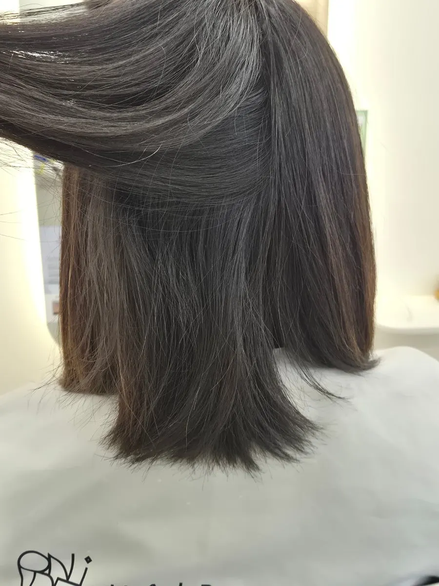 Before photo of shoulder-length hair before the volume magic perm