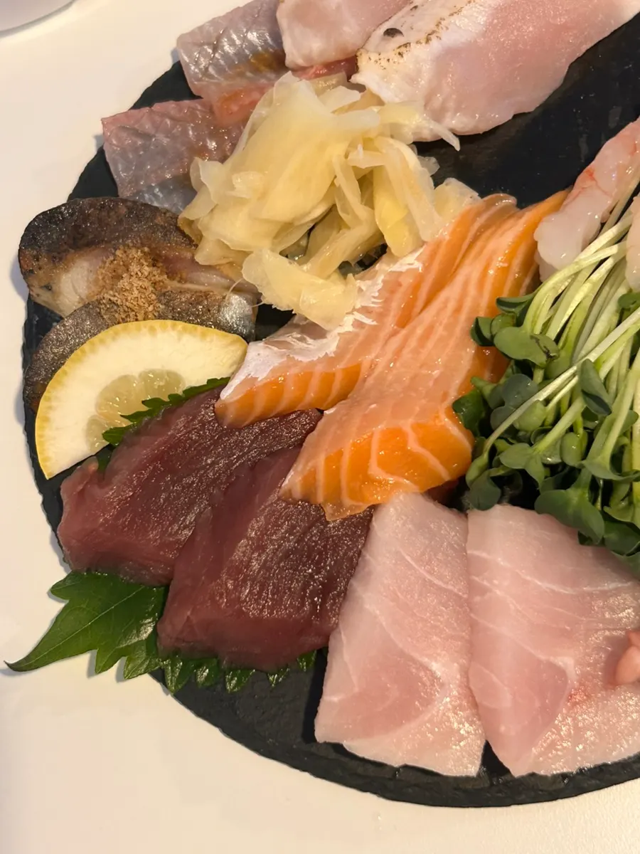Assorted sashimi served with pickled ginger and fresh wasabi