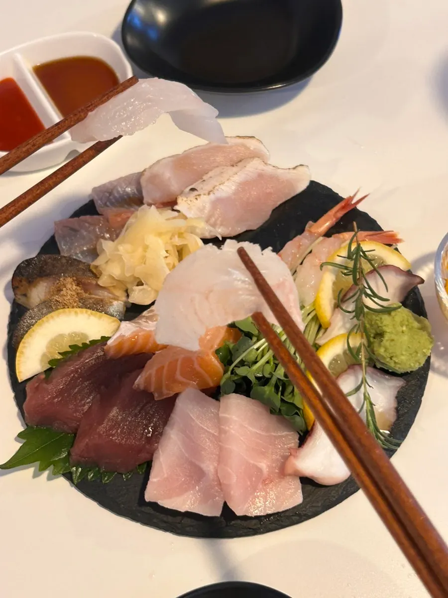 A piece of aged white fish sashimi