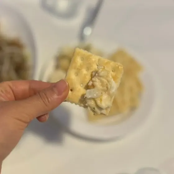 Close-up of a bite of potato salad cracker