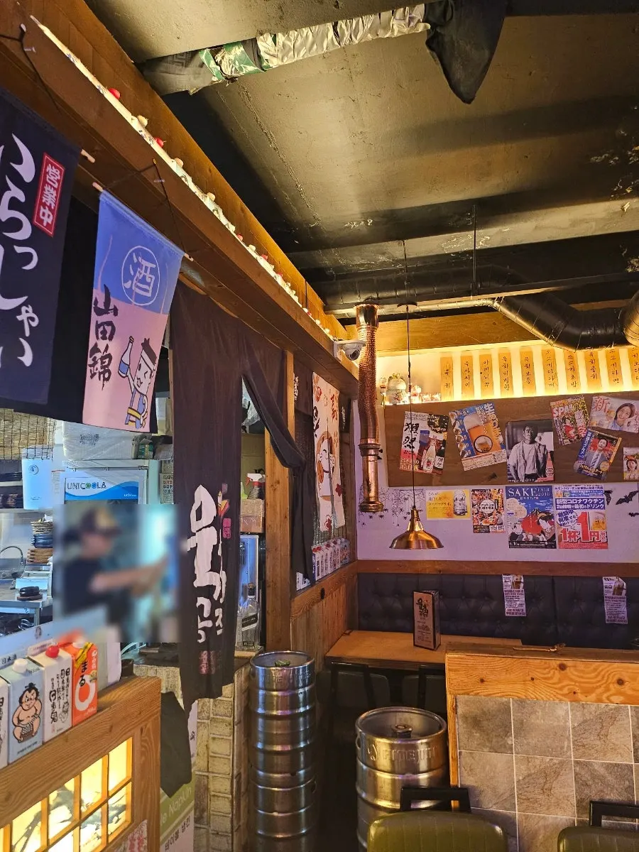 Full view of partitioned booth seating at the bar