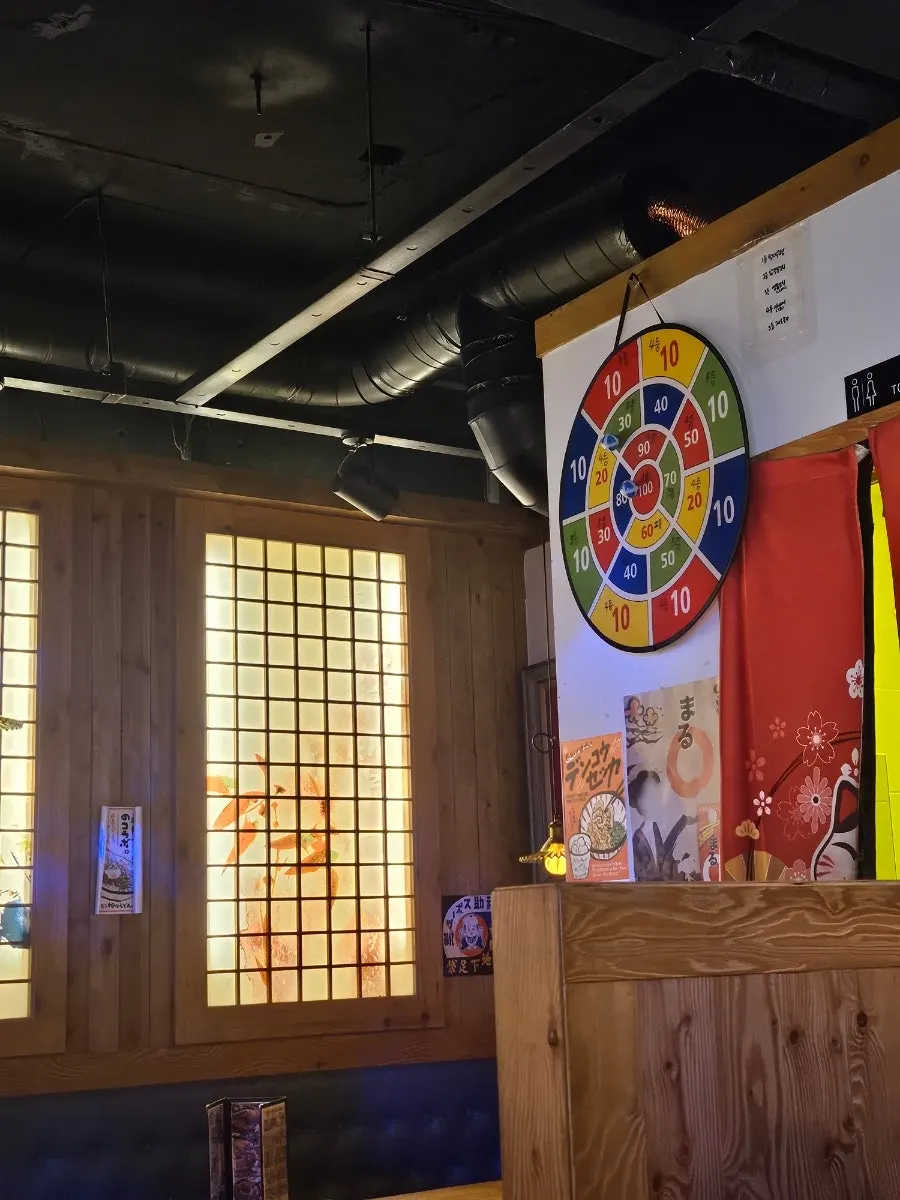 Izakaya-style lighting and seating in the restaurant