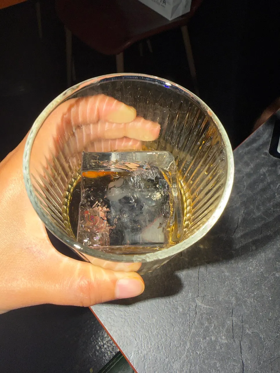 Large ice cube and whiskey order