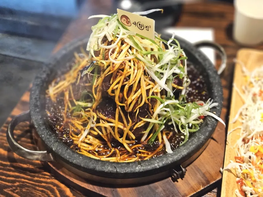 Bone grill bubbling on the stone plate