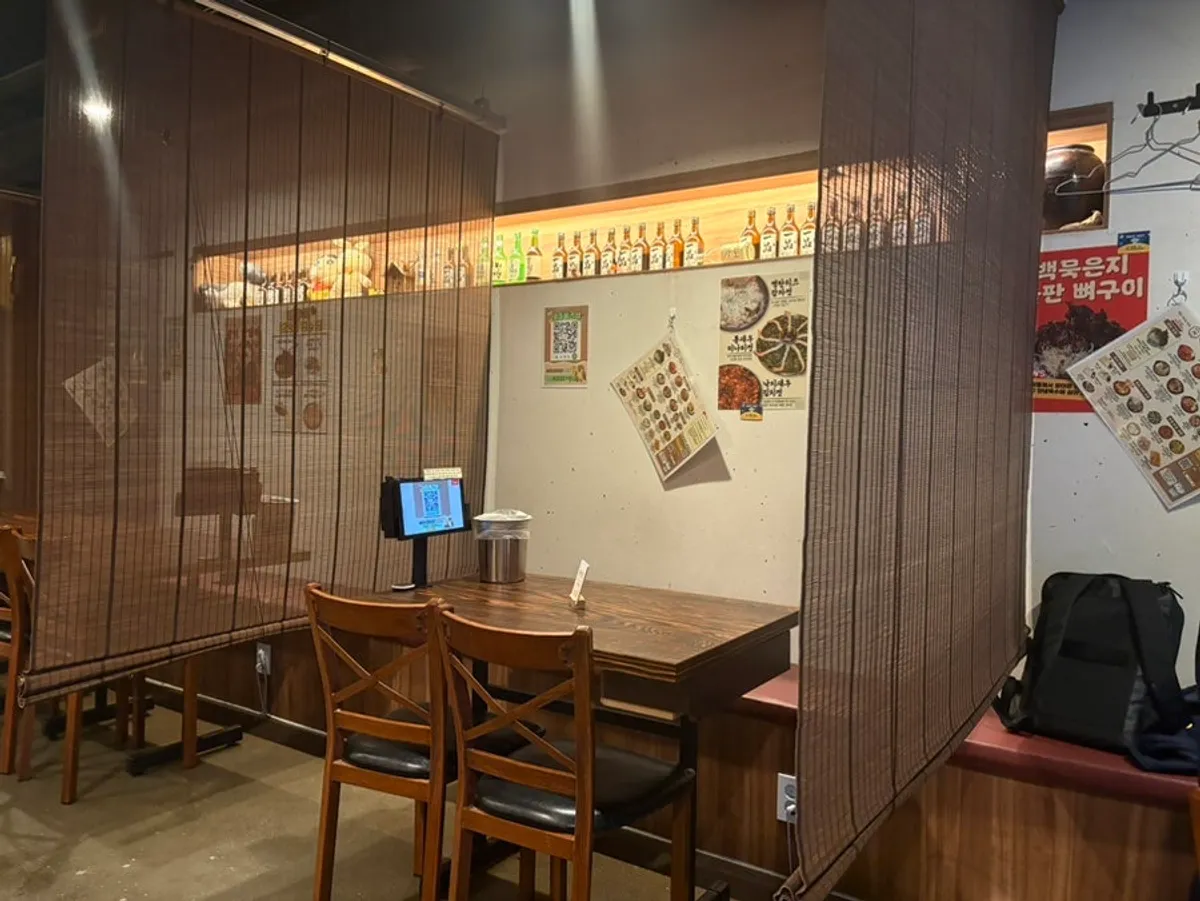 Spacious interior of Saechamjip's Gunja branch with roomy tables