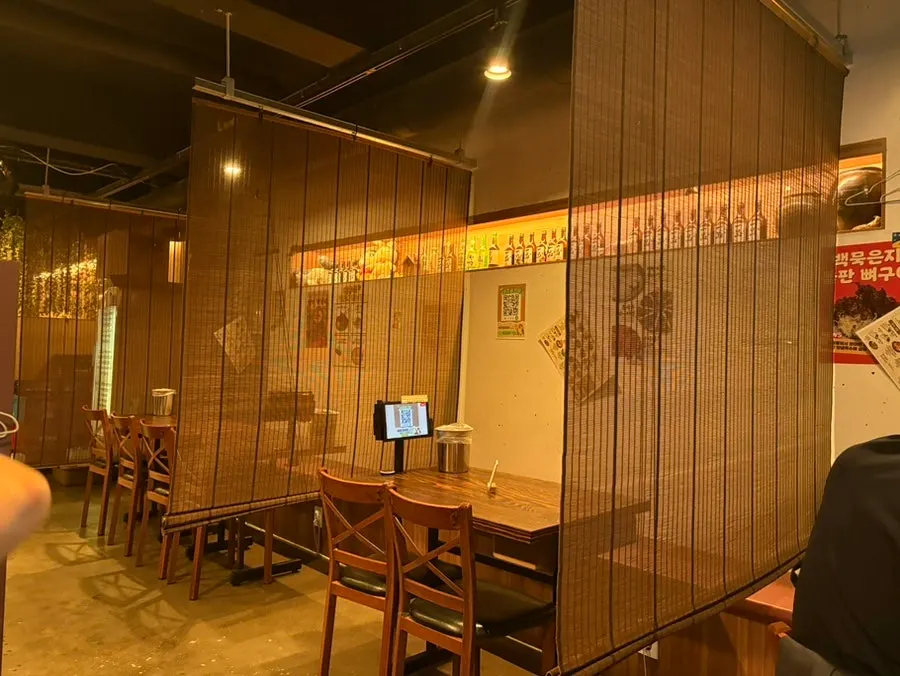 Seating area inside Saechamjip with a Korean-bar atmosphere