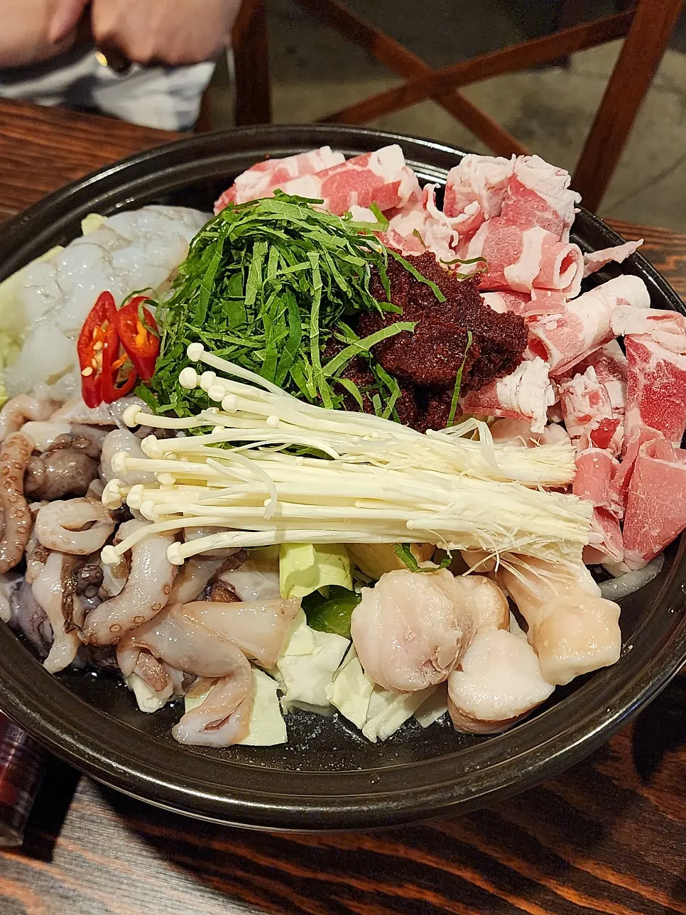 Nakgopsae stew served before cooking
