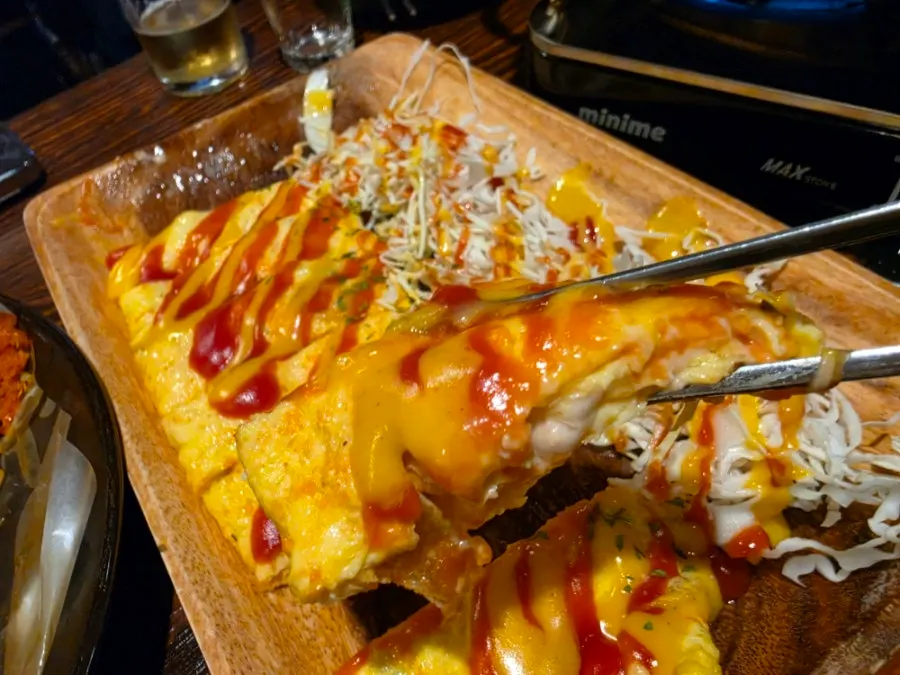 Cross-section of rolled omelet filled with pollock roe mayo