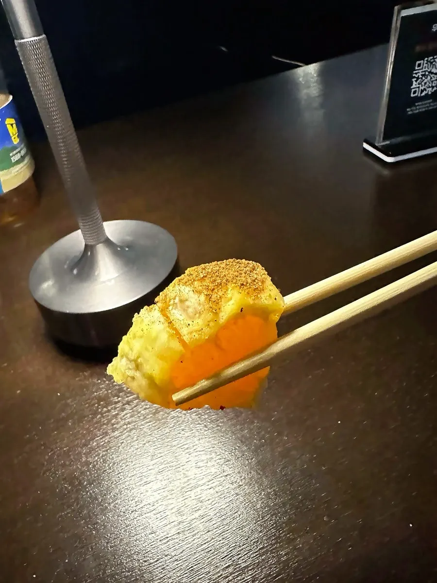 Signature Woowoo cocktail with a snack