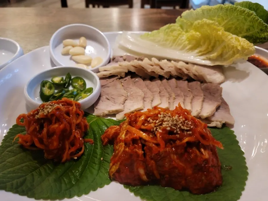 Fresh cabbage served alongside the bossam