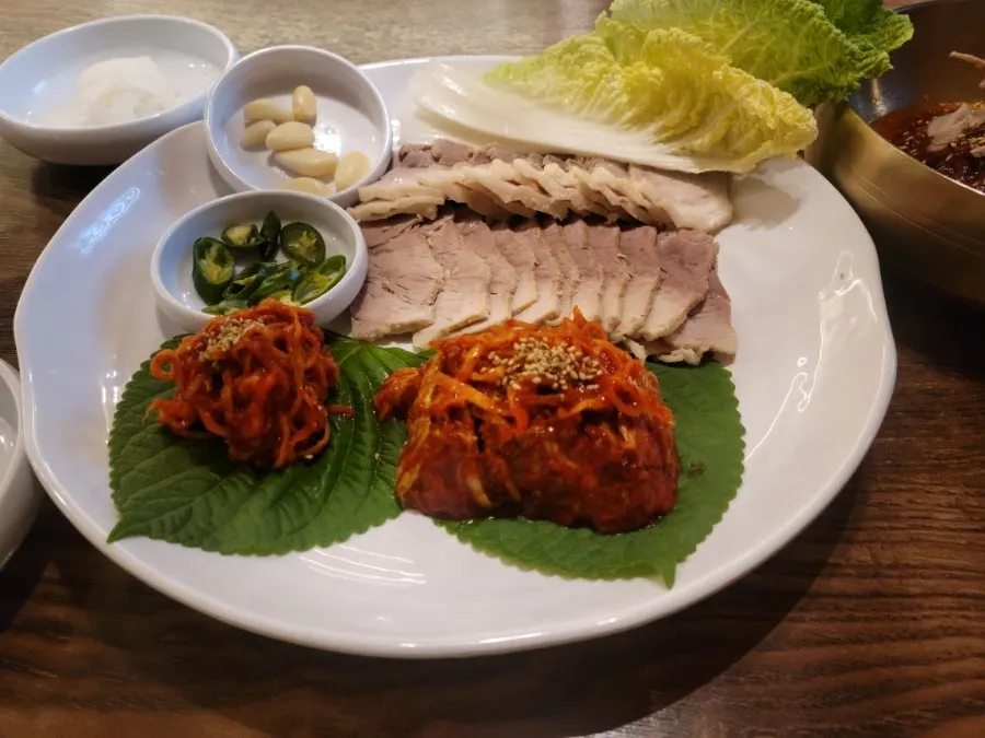 Napa cabbage kimchi served with bossam at Sosa Myeonok