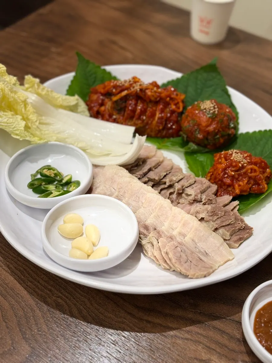 Mul naengmyeon with toppings and squid-ink noodles