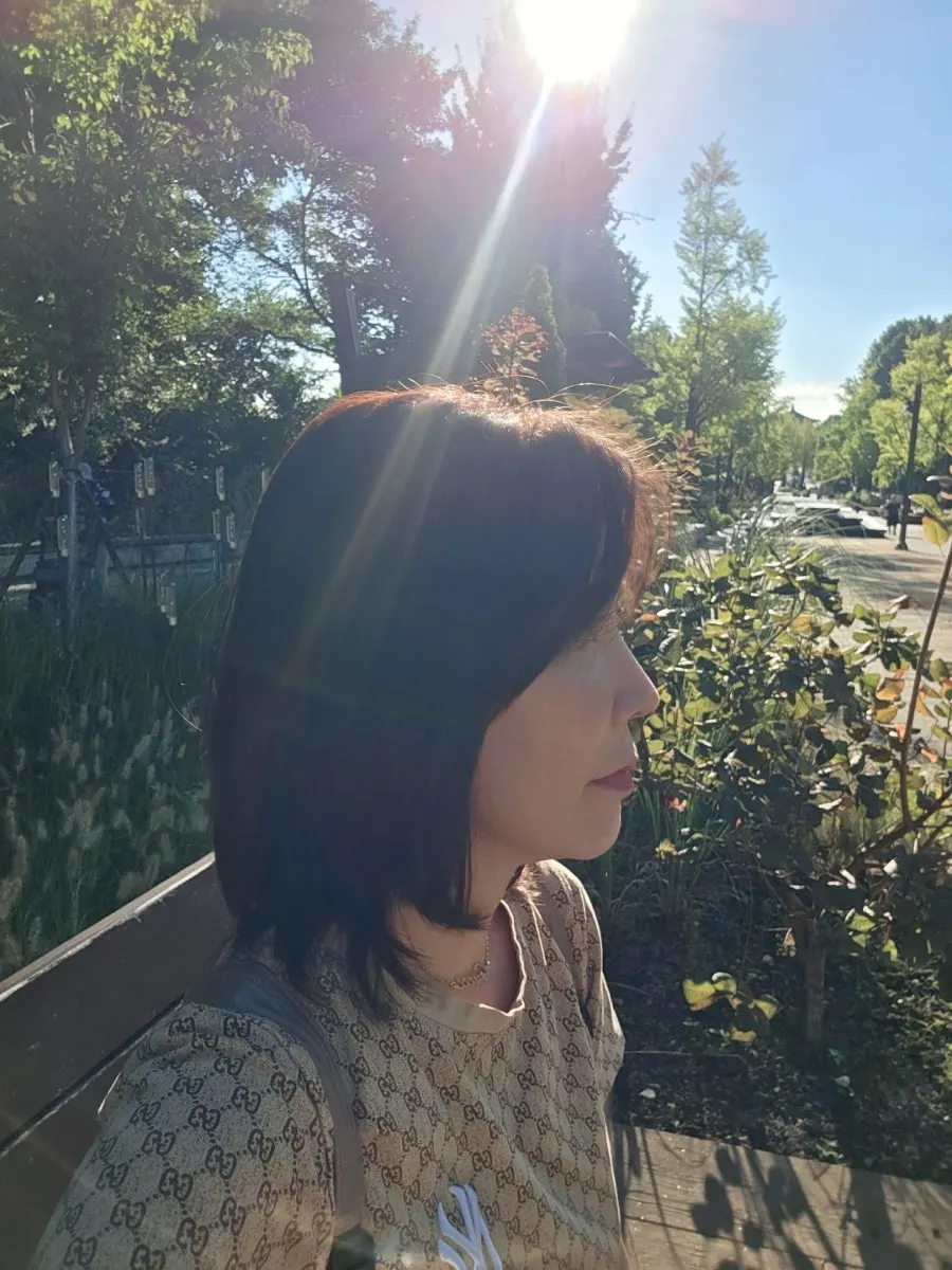 Finished mid-length layered cut after tone-down color