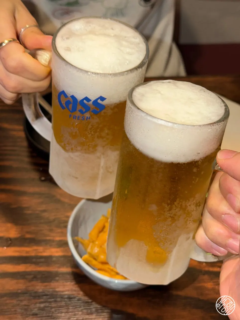 Two frosty glasses of draft beer at Saechamjip