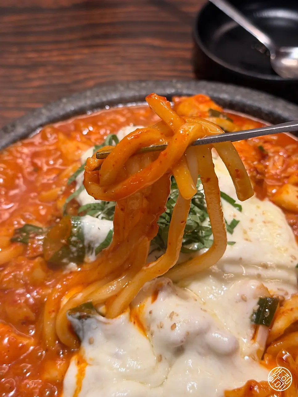 Udon noodles mixed into the dakgalbi sauce