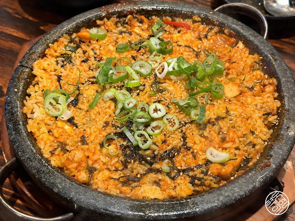 Preparing dakgalbi fried rice with added flying fish roe