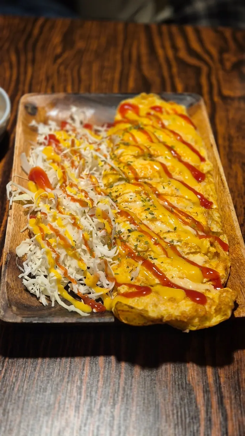 Egg roll served as a bar snack with beer