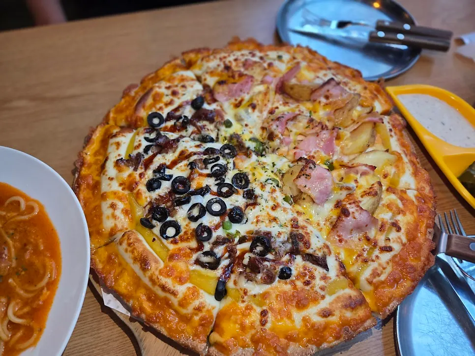 Half-and-half pizza loaded with toppings