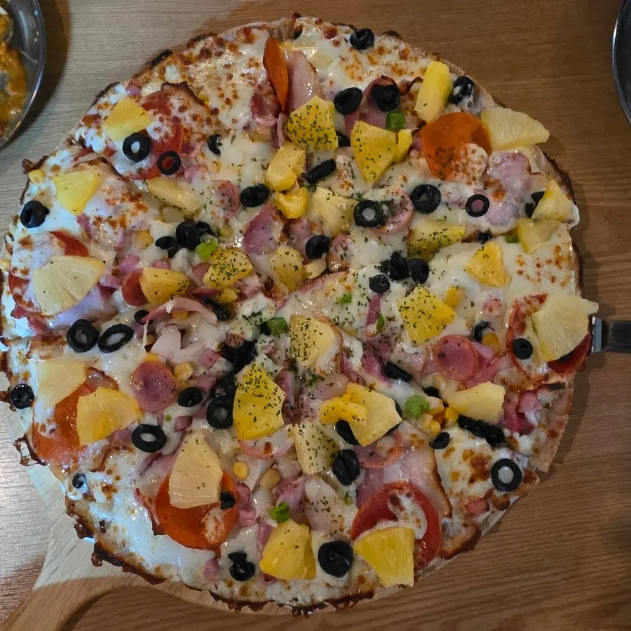 Pepperoni pizza piled high with toppings
