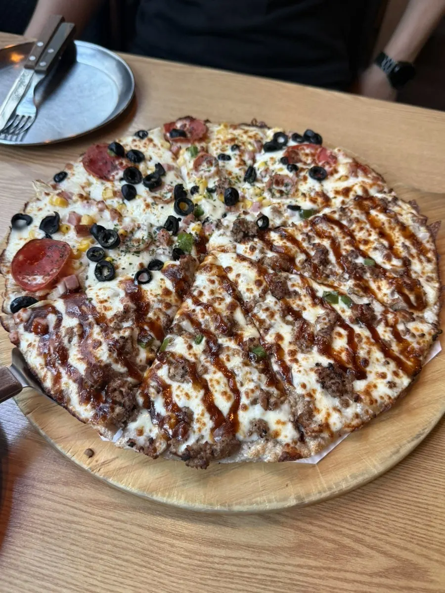 A whole large half-and-half pizza