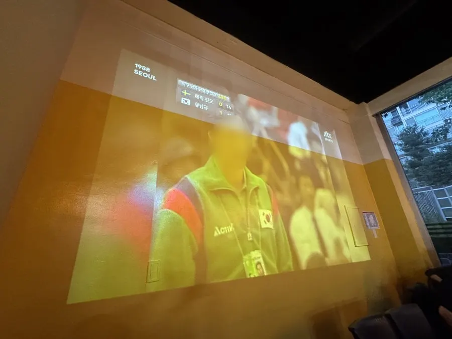 Pizza-and-beer space with a large video screen