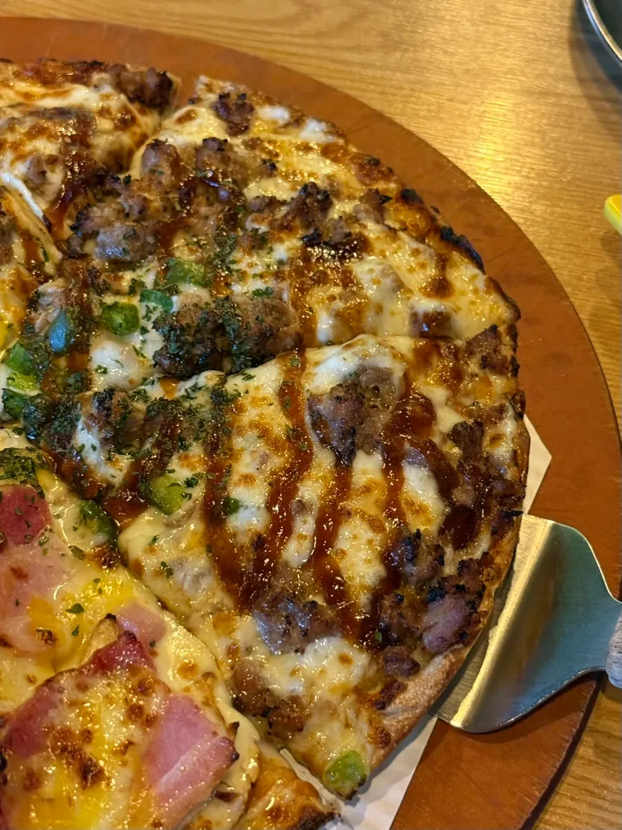 Close-up of the toppings split between the two pizza halves