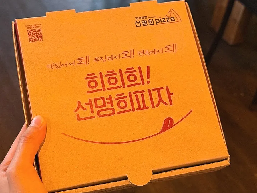 Two remaining slices of medium pizza on the table setting