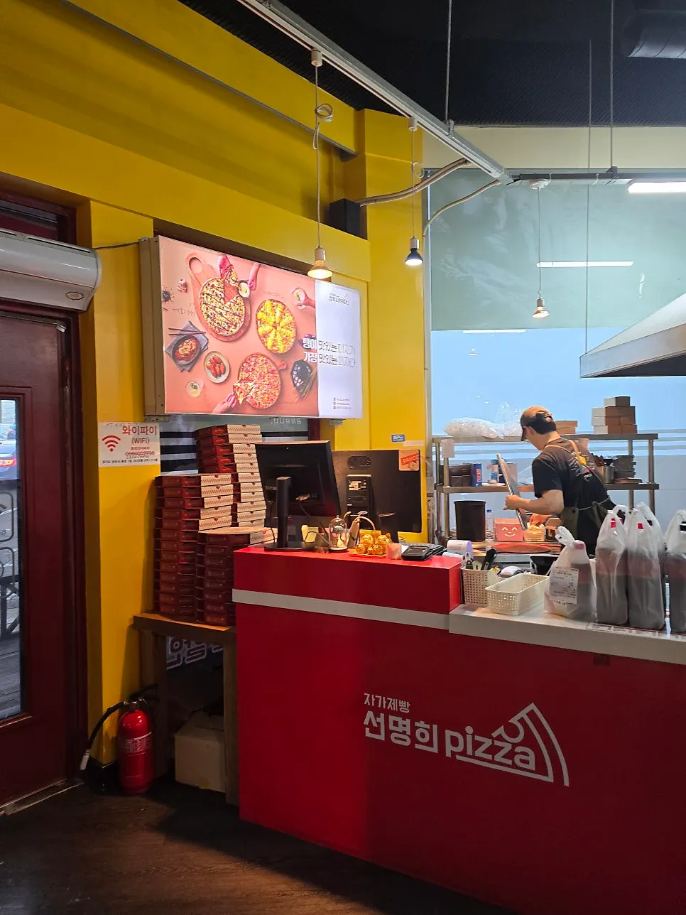 Store area with signage about in-house made dough