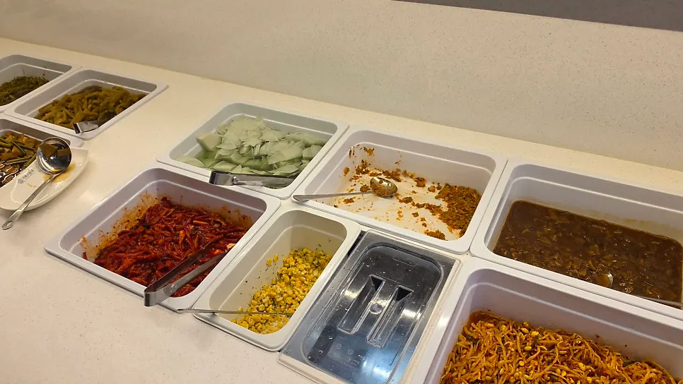 Vegetables and wrap ingredients at the self-serve bar