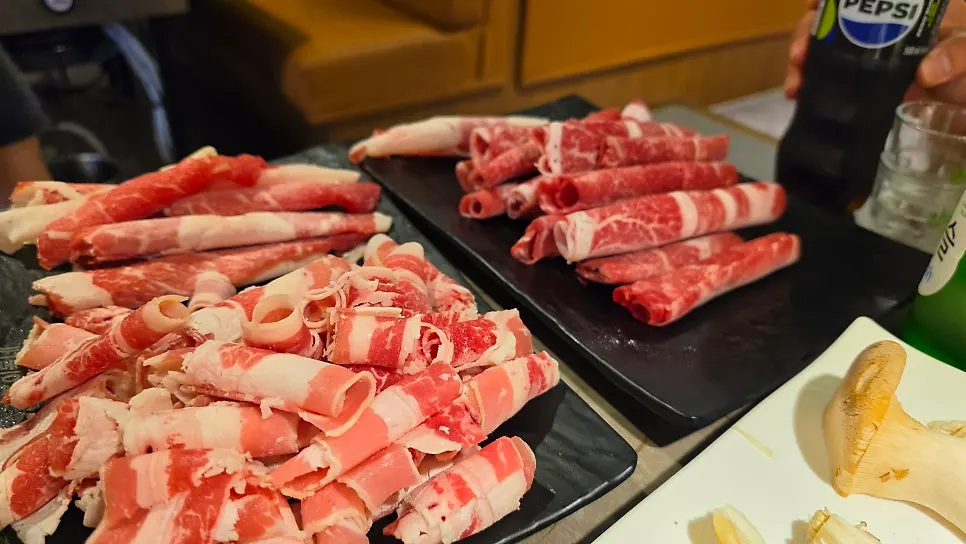 Thin-sliced meat on the grill