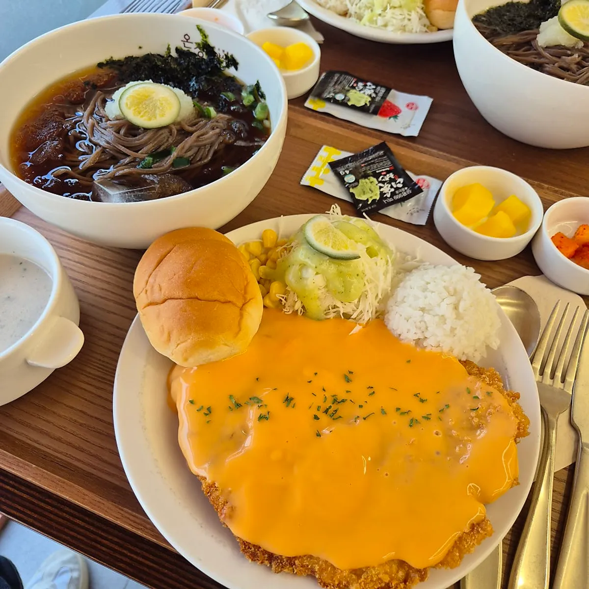 Cheese soba set with cheddar cheese on top of the cutlet