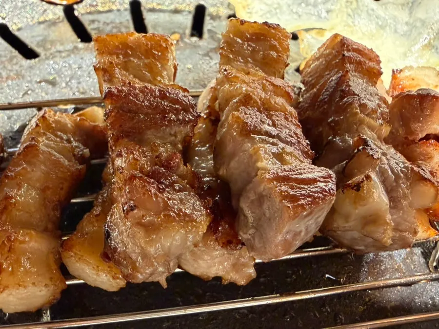 14-day aged pork belly grilling on the pan
