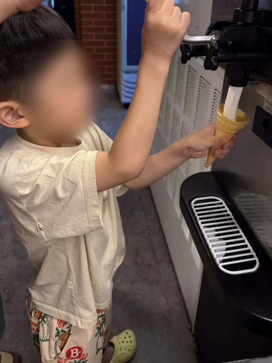 Milk-flavored ice cream scooped into a cup