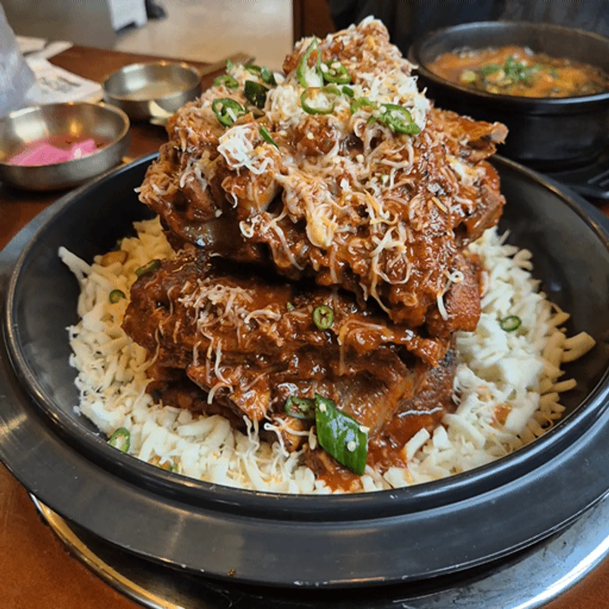 Cheese spicy pork bone grill served over a bed of cheese