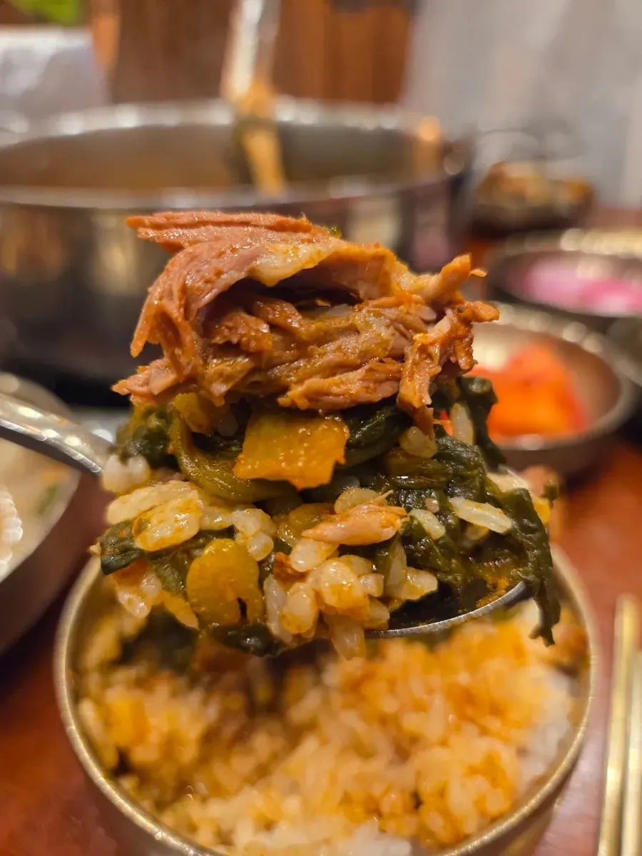 White rice topped with gamjatang broth