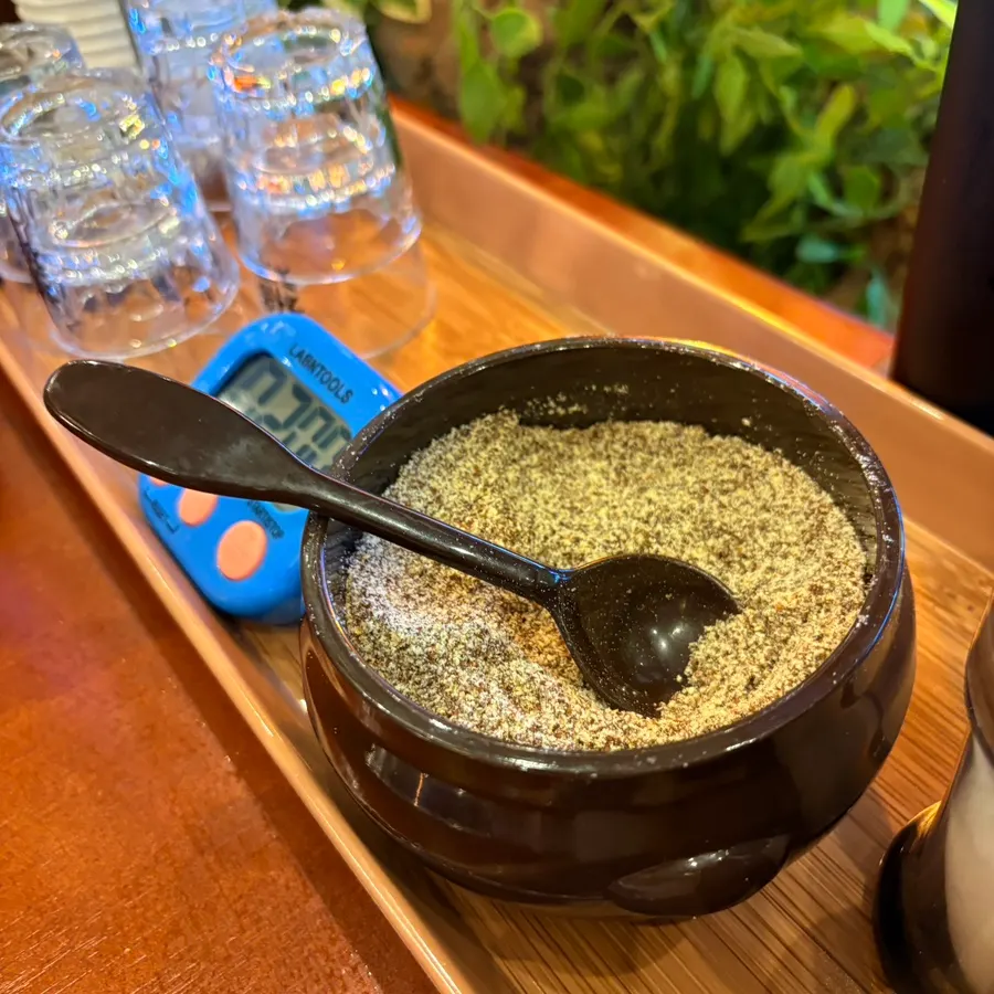 Boiled gamjatang and perilla powder on the table